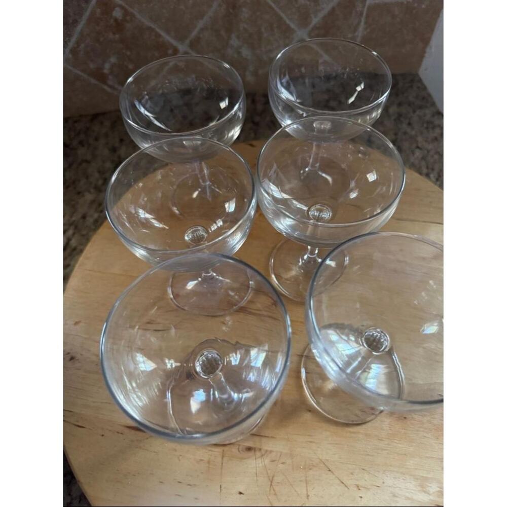 Six clear glass coupe style cocktail